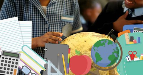 Engaged african american students exploring globe in classroom