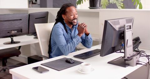 Businessman Engaged with Computer in Modern Office Environment - Download Free Stock Images Pikwizard.com