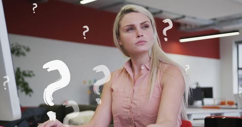 confused businesswoman with question marks in office - Download Free Stock Images Pikwizard.com