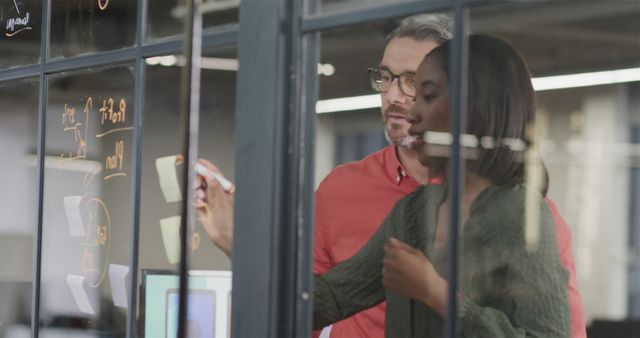 Team Collaboration Brainstorming Through Office Glass Wall - Download Free Stock Images Pikwizard.com