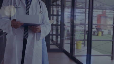 Caucasian Doctor Networking with Modern Technology Overlay