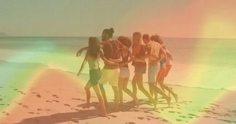 Group of friends walking together on tropical beach