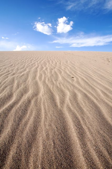 Sand Dunes Under Clear Blue Sky in Desert - Download Free Stock Photos Pikwizard.com