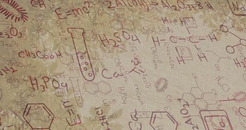 High school students analyzing chemical formulas on desk
