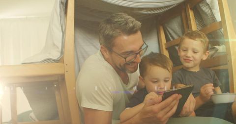 Father Enjoying Quality Time with Sons Using Tablet