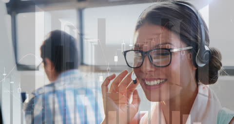Smiling Consultant with Finance Charts in Modern Office