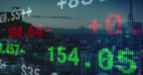 Digital stock market ticker over urban skyline