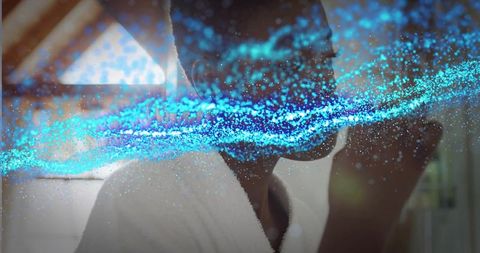 Standing black woman wearing white bathrobe featuring glowing blue particle wave overlay