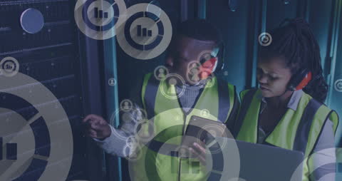 Tech Engineers Analyzing Data in Server Room Environment