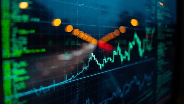 Stock Market Data on Digital Screen with Blurred Bokeh Lights