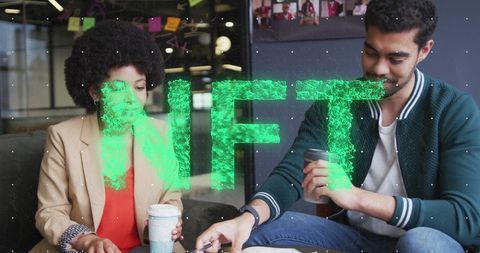 Colleagues Discussing NFT Project in Modern Office Environment