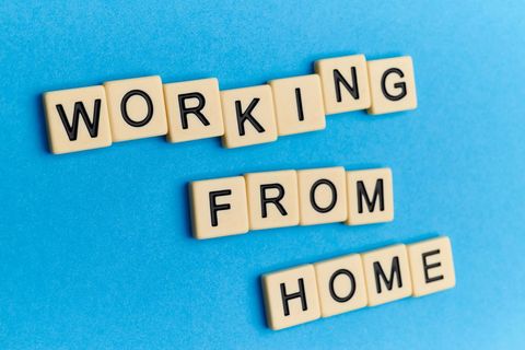 Working from Home Concept with Text on Blue Background