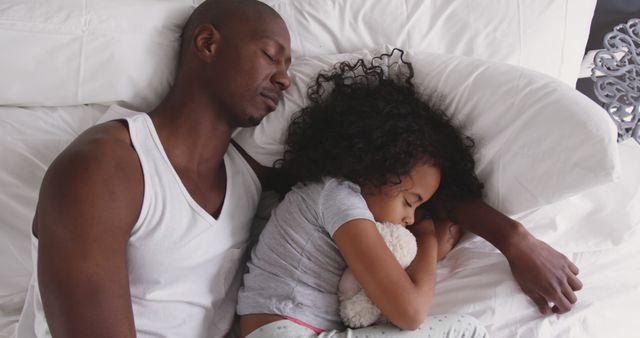 Father and Daughter Sleeping Peacefully Together in Bed - Download Free Stock Images Pikwizard.com