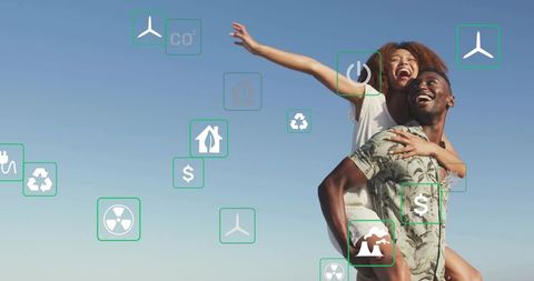 Joyful Couple Embracing Sustainable Energy Symbols Outdoors