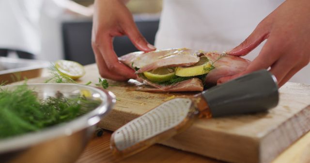 Chef Preparing Stuffed Fish with Fresh Herbs and Lemon - Download Free Stock Images Pikwizard.com