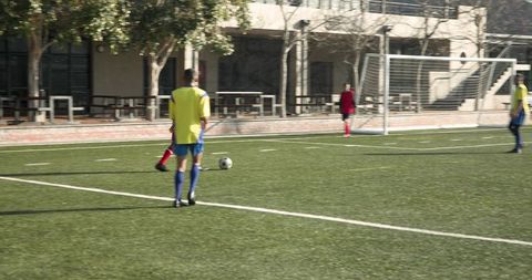 Youth soccer players practicing on field enhancing skills