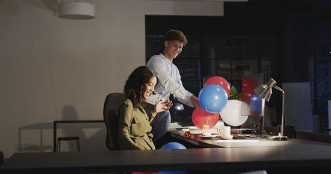 Diverse Team Celebrating Birthday with Balloons in Office
