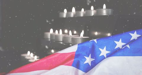 Snowfall Over Memorial Candles and United States Flag Representation - Download Free Stock Images Pikwizard.com