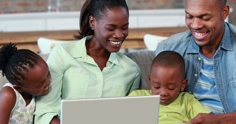 Happy African American Family Bonding Over Laptop at Home - Download Free Stock Images Pikwizard.com