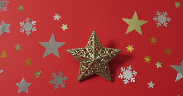 Christmas decorations with stars and snow patterns on red background. christmas, tradition and celebration concept.