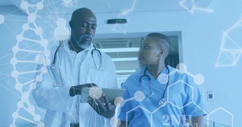 African American Doctors Analyzing Digital Medical Data