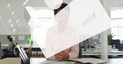 Executive Analyzing Financial Data in Modern Office Environment