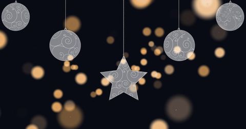 Hanging Ornaments with Glowing Lights on Black Background