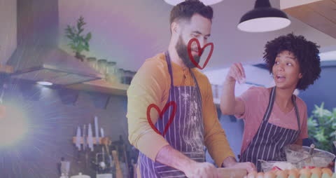 Romantic Couple Cooking Together with Digital Heart Animation