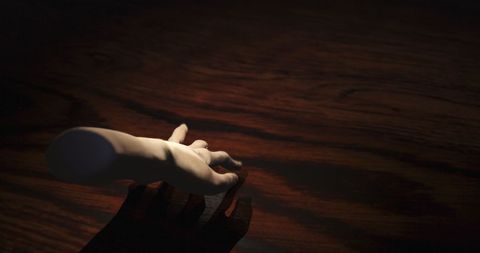 Creepy Hand Walking Across Dark Wooden Surface - Download Free Stock Images Pikwizard.com