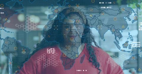 Woman monitoring global data visualization overlay in modern office, smiling and confident