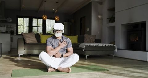Older Man Meditating with VR Headset in Modern Living Room