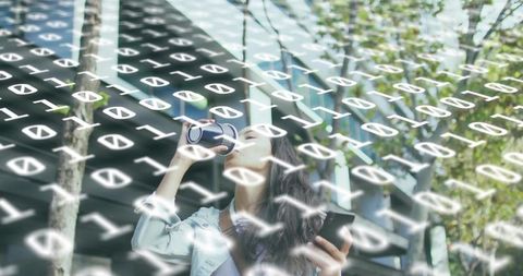 Young woman drinking coffee using smartphone with digital binary overlay urban backdrop