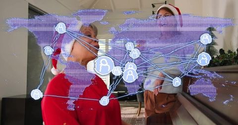 Grandmother and daughter wearing santa hats singing at piano with ar global network overlay