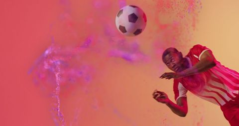 Dynamic African American Soccer Player With Ball In Mid-Air Action - Download Free Stock Images Pikwizard.com