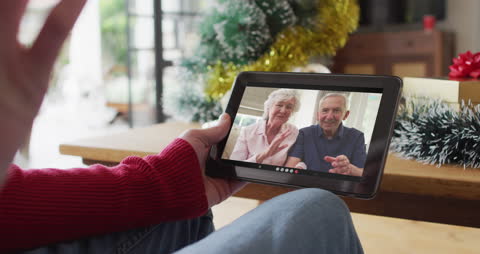 Senior Couple Enjoying a Christmas Video Call with Family