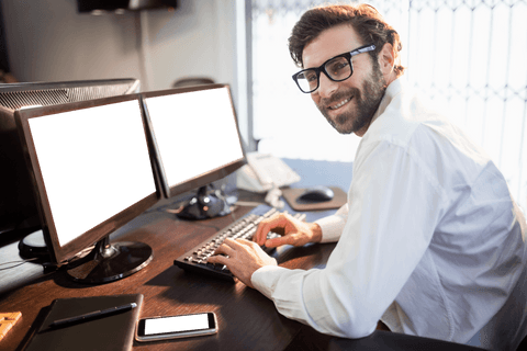 transparent professional working at desk with computer in office environment - Download Free Stock Videos Pikwizard.com
