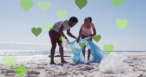 Couple cleans beach with creative illustrations of environmental love