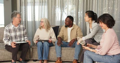 Diverse Therapy Group Having Successful Session Celebrating Progress