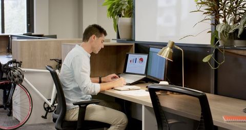 Focused Professional Writing Notes in Modern Office Workspace