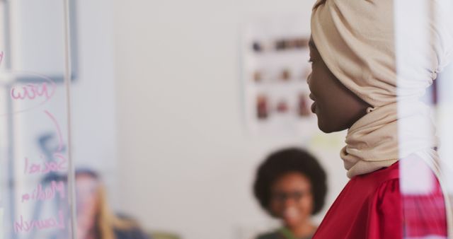 Businesswoman in Hijab Leading Team Meeting in Modern Office - Download Free Stock Images Pikwizard.com