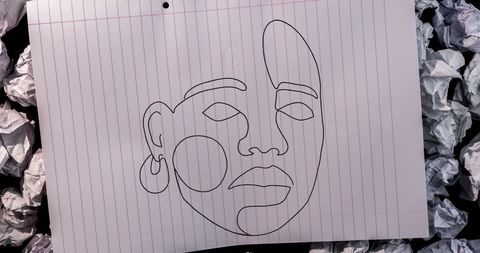 Minimalist Sketch of Woman Face on Lined Paper with Crumpled Background - Download Free Stock Images Pikwizard.com