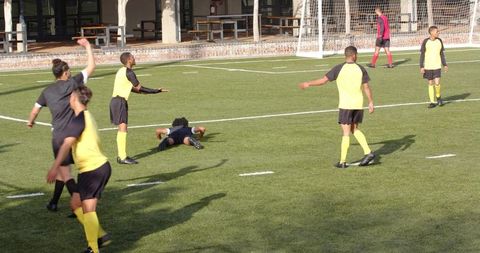 Teen Players Engaged in Intense School Soccer Match Action