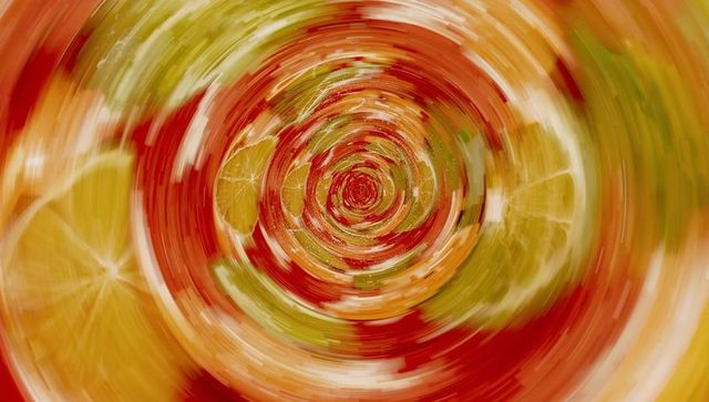 Dynamic Citrus Vortex with Vibrant Geometric Swirl Effect