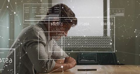 Man leaning on desk with phone, studying digital analytics and network visualization overlays