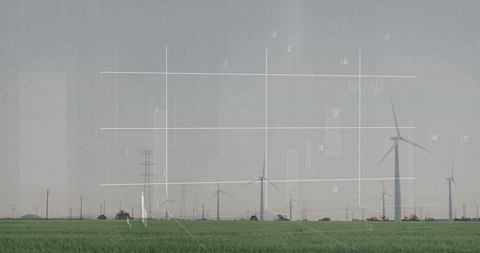 Wind farm generating clean energy with transparent data overlay and infographic elements