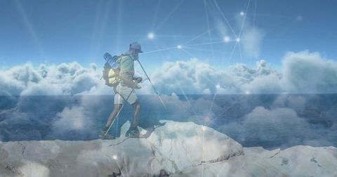 Hiker on rocky ridge with digital network overlay