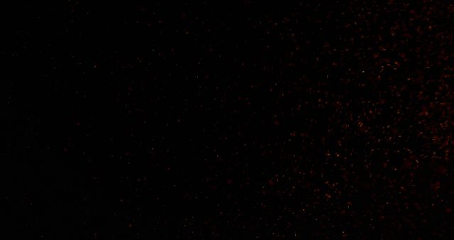 A dark background with subtle red sparkles, with copy space - Download Free Stock Photos Pikwizard.com