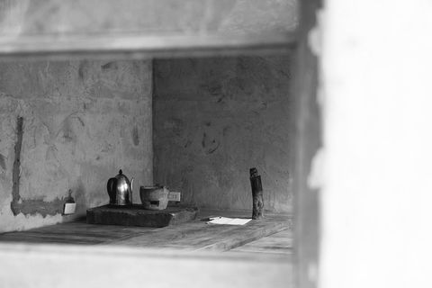 Vintage kitchen interior with old teapot and utensils in black and white