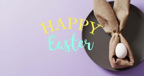 Creative easter concept with egg wrapped as bunny ears on purple background