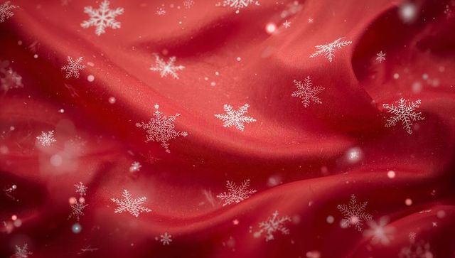 Elegant red fabric with white snowflake motifs in holiday style